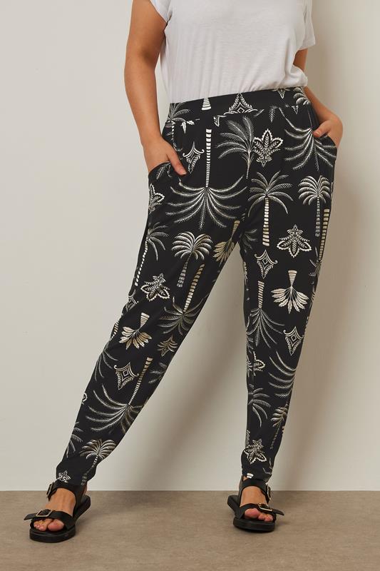 Yours YOURS Curve Black Palm Print Harem Trousers