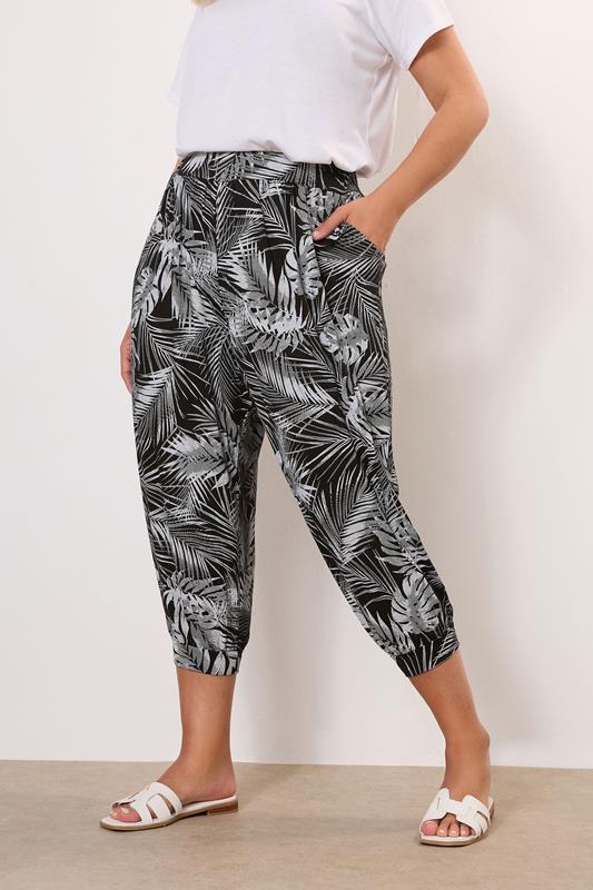 Yours YOURS Curve Black Leaf Print Cropped Harem Trousers