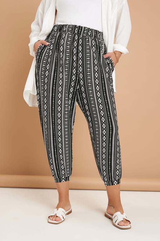 Yours YOURS Curve Black Aztec Stripe Cropped Harem Trousers