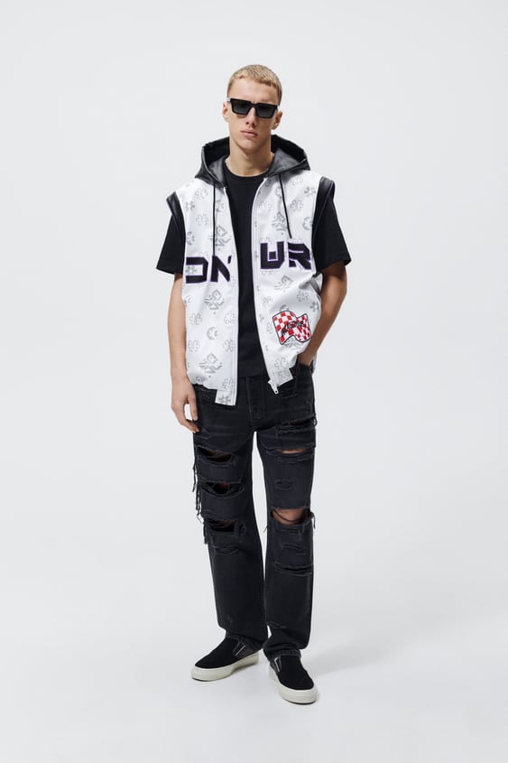PRINTED PATCH FAUX LEATHER VEST