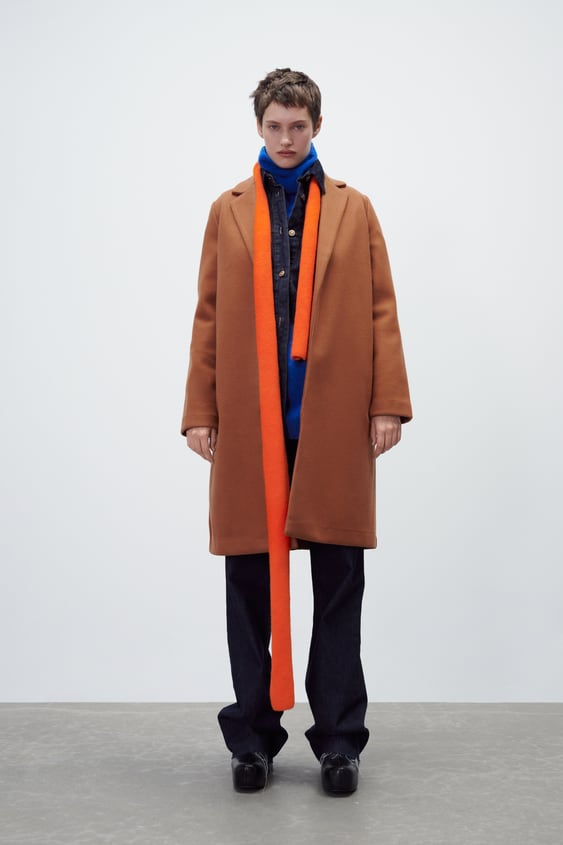 COAT with lapel collar and long sleeves.