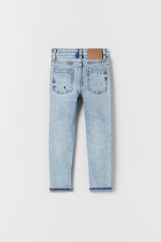 DESTROYED SKINNY JEANS