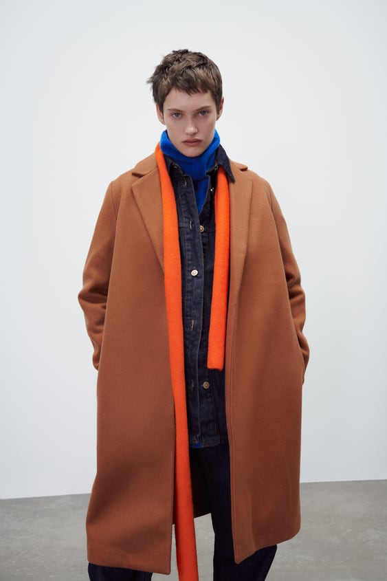 COAT with lapel collar and long sleeves.