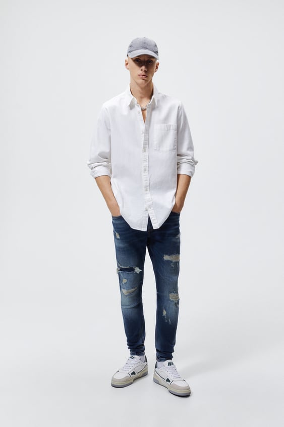 RIPPED SKINNY JEANS WITH TOPSTITCHING