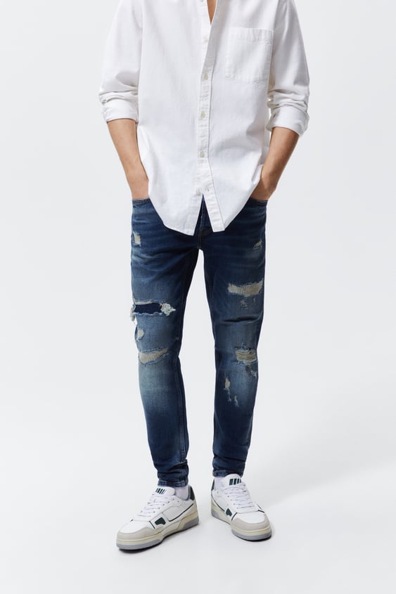 RIPPED SKINNY JEANS WITH TOPSTITCHING