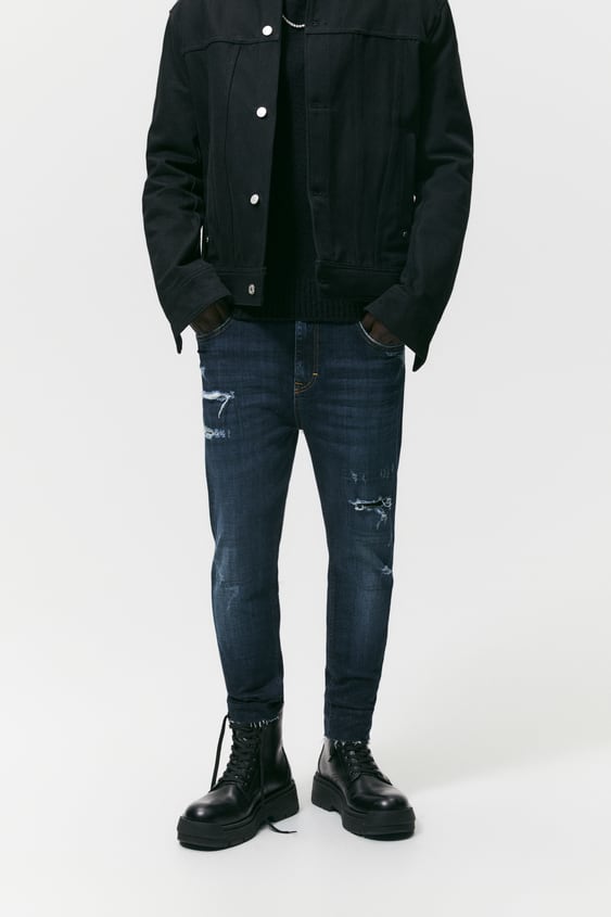 TAPERED RIPPED JEANS